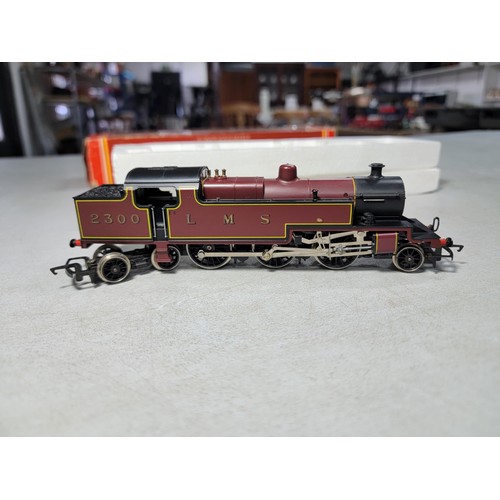 39 - Boxed Hornby R055 class 4P 2-6-4 LMS crimson lake tank loco No.2300 with crew pack cleaned and servi... 