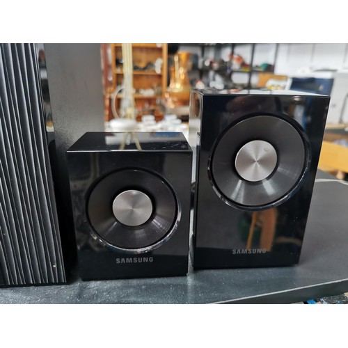 175 - A Samsung surround sound audio system. In great working condition complete with all its separate spe... 