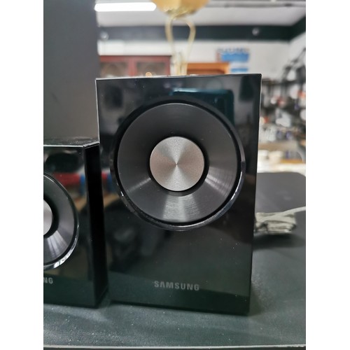 175 - A Samsung surround sound audio system. In great working condition complete with all its separate spe... 