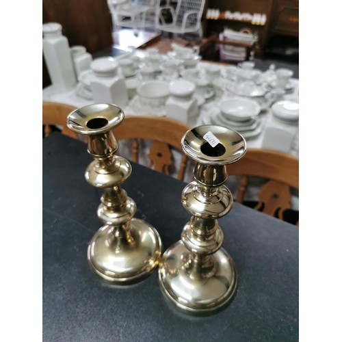 196 - Pair of brass candlesticks with spring loaded adjusters