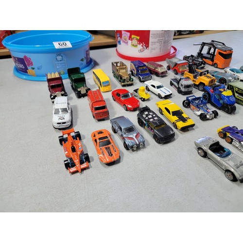 60 - 2 tubs full of various diecast cars and trucks from various makers inc matchbox hot wheels welly etc