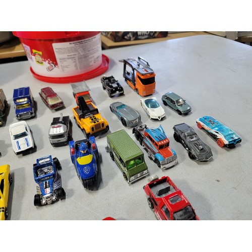 60 - 2 tubs full of various diecast cars and trucks from various makers inc matchbox hot wheels welly etc