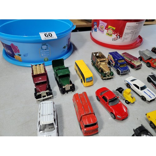 60 - 2 tubs full of various diecast cars and trucks from various makers inc matchbox hot wheels welly etc