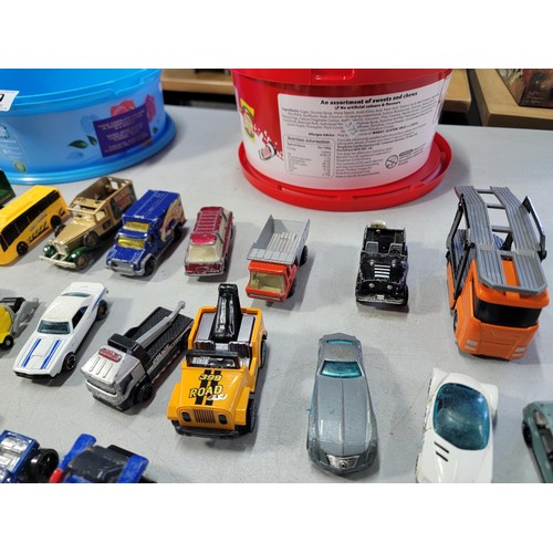 60 - 2 tubs full of various diecast cars and trucks from various makers inc matchbox hot wheels welly etc