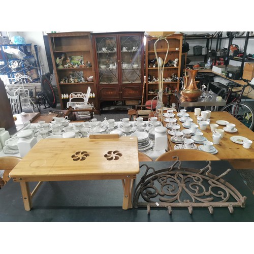 538 - Cast iron wall hanging pan rack along with a wooden lap table with lift up lid with floral cut outs,... 