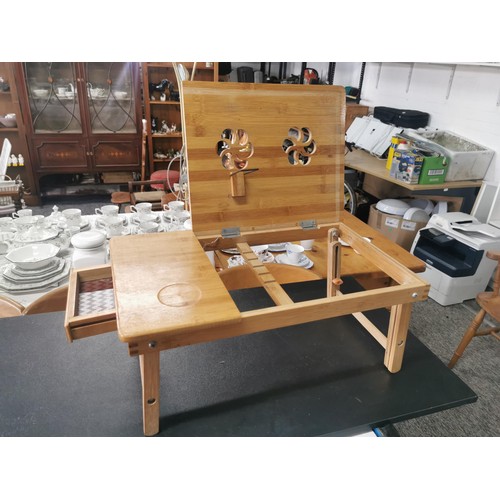 538 - Cast iron wall hanging pan rack along with a wooden lap table with lift up lid with floral cut outs,... 