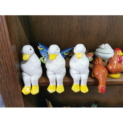 545 - 2x shelves full of collectable ceramic figures to inc a large quantity of 27x ceramic hand painted w... 