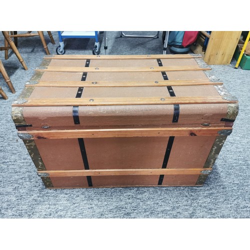 550 - Large storage trunk with timber bands in good condition its 77cm by 47cm make great coffee table