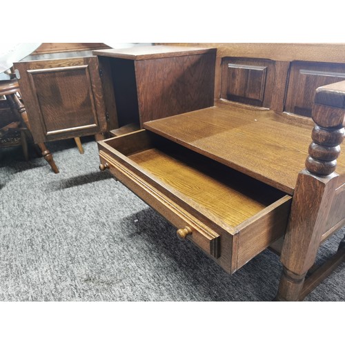 553 - Solid oak telephone table seat with drawer and cupboard in great condition with nice aged patina
109... 