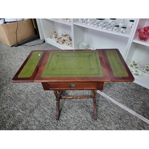 85 - A vintage green leather top regency style drop leaf occasional table. Measures with the leaves down ... 