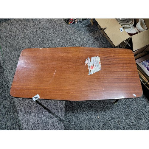 86 - A retro 1970's coffee table (sticker to the top needs removing), along with a small footstool. Has a... 