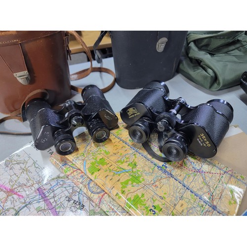 68 - 2x pairs of cased binoculars along with a bag full of various maps and ephemera relating to an RAF p... 