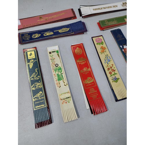 77 - large quantity of various genuine leather book marks each one having a different motif which include... 