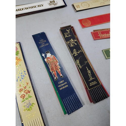 77 - large quantity of various genuine leather book marks each one having a different motif which include... 