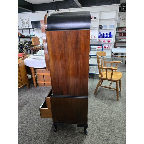 548 - An Art Deco linen chest. Walnut doors and ebonised top, with 3 inner drawers and two outer lower dra... 