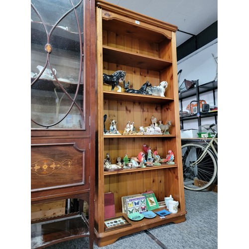 580 - A five division pine book shelf. with adjustable height shelves 181 cm high 87 cm wide 30cm deep