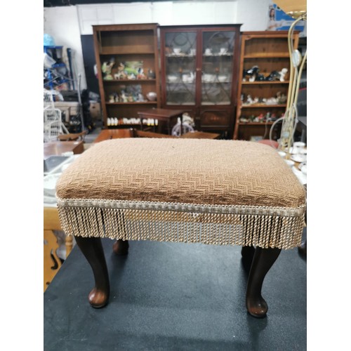 564 - A pair of upholstered stools with wooden cabriole legs. Both in the same fabric in good condition