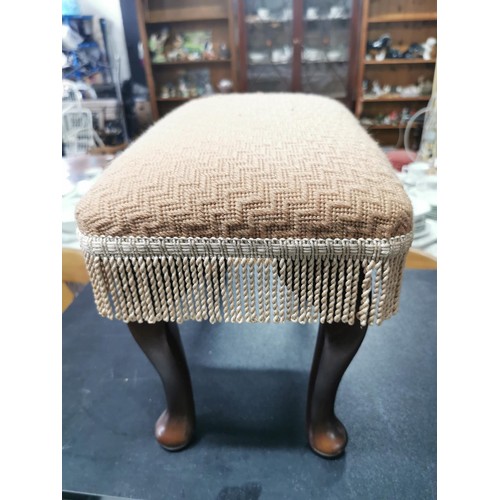 564 - A pair of upholstered stools with wooden cabriole legs. Both in the same fabric in good condition