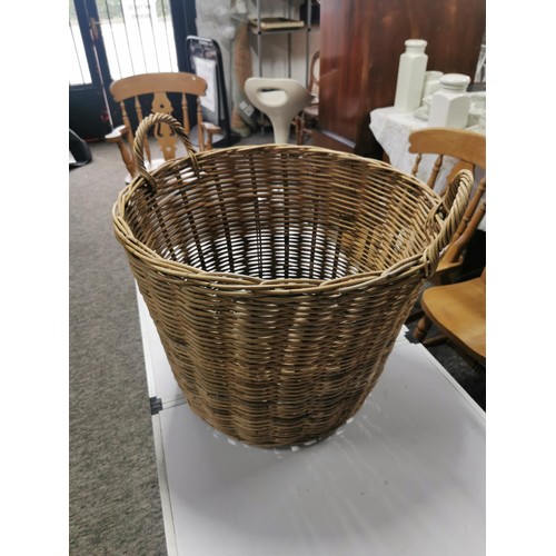 567 - A wicker log basket along with one other long basket