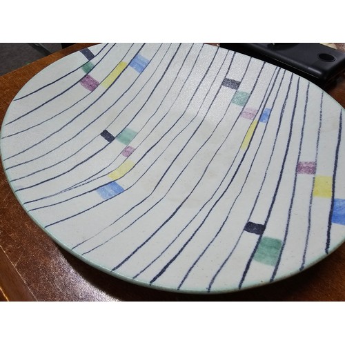 364 - A good signed studio pottery charger with a mosaic design by Ruscha Handgemalt, has a small chip to ... 