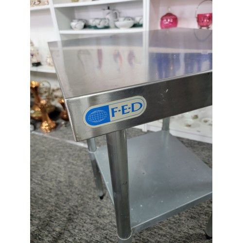 581 - Good quality stainless steel square catering table F.E.D. with a lower shelf in good clean condition... 