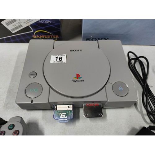 16 - A Sony Playstation dual shock edition games console along with a good selection of games. In great c... 