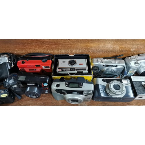 57 - A large quantity of various cameras to include SLR and digital cameras and a pair of binoculars. The... 