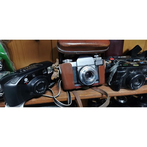 61 - A quantity of vintage film and digital cameras to include an Olympus Trip AF MD, an Olympus AZ-1 Zoo... 