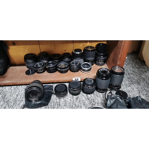 64 - A large quantity of various camera lenses to include Sigma, pentagon, Vitacon, Centon, Cosina, etc.