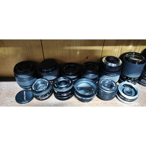 64 - A large quantity of various camera lenses to include Sigma, pentagon, Vitacon, Centon, Cosina, etc.