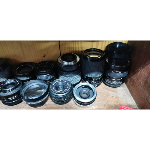 64 - A large quantity of various camera lenses to include Sigma, pentagon, Vitacon, Centon, Cosina, etc.