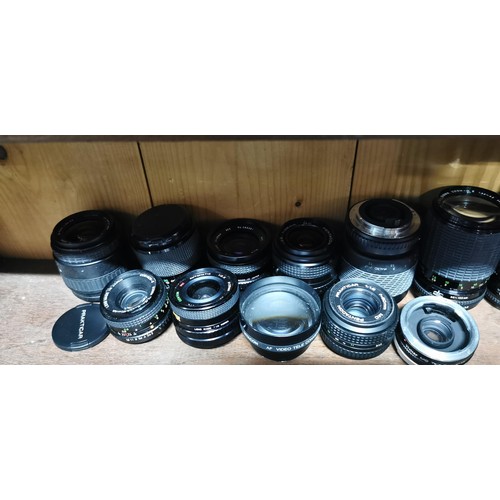 64 - A large quantity of various camera lenses to include Sigma, pentagon, Vitacon, Centon, Cosina, etc.