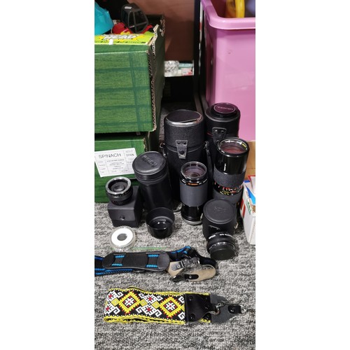 65 - A quantity of camera lenses to include a Tamrom, Zoom macro lens, a Kiron macro zoom lens, a tele co... 