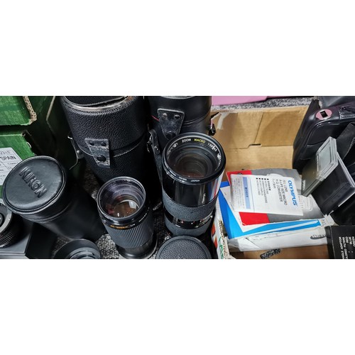 65 - A quantity of camera lenses to include a Tamrom, Zoom macro lens, a Kiron macro zoom lens, a tele co... 