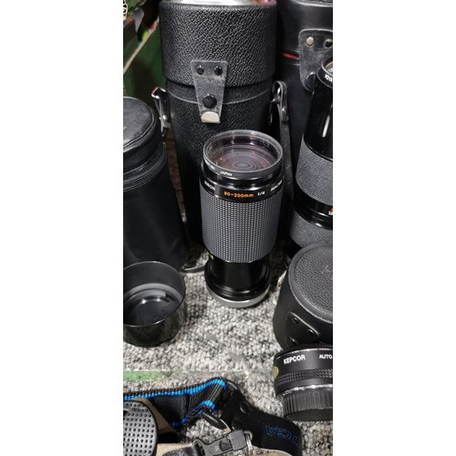 65 - A quantity of camera lenses to include a Tamrom, Zoom macro lens, a Kiron macro zoom lens, a tele co... 