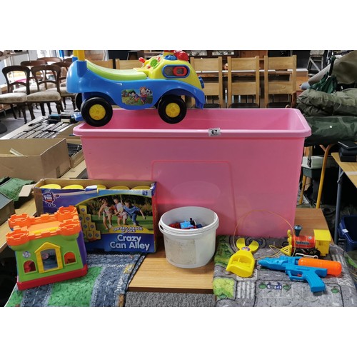 67 - A large quantity of Children's toys in a large pink storage box to include Crazy Can Alley, a ride o... 