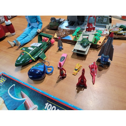 31 - Large collection of Thunderbirds related toys and games inc Thunderbird 2, a Thunderbird 1 rocket, 4... 