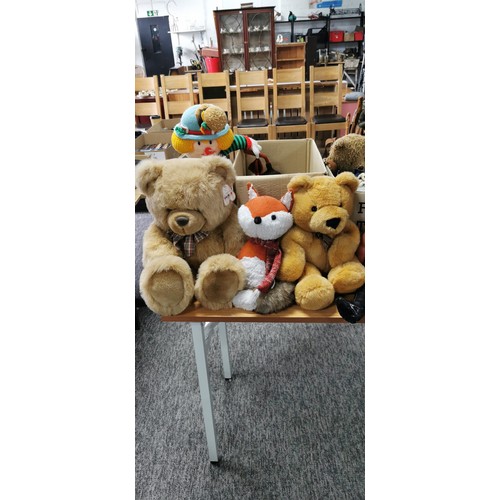 69 - 2 boxes full of soft toys teddy bears and dolls some of a vintage. Including a large Aurora teddy be... 