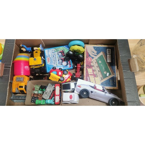 71 - A box full of various children's toys along with an large empty Bells scotch whisky 5l bottle. Inclu... 