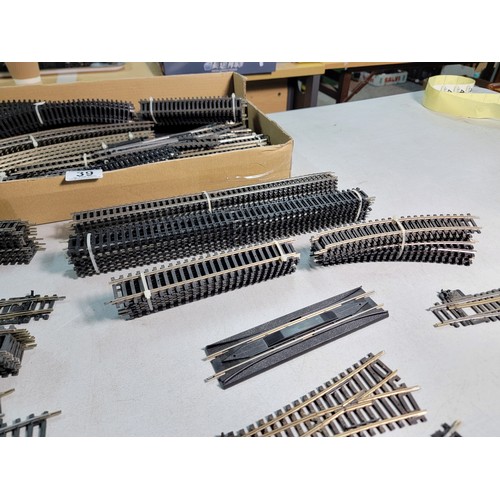 39 - Box containing a large quantity of Hornby OO gauge inc straight and curved track, directional track ... 