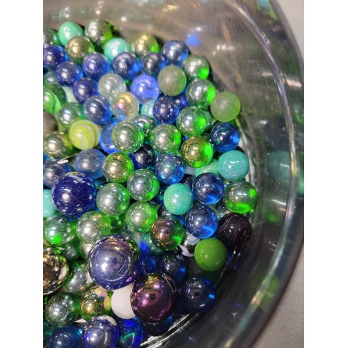 46 - A tub of modern marbles mostly are iridescent solid colours all in good condition.