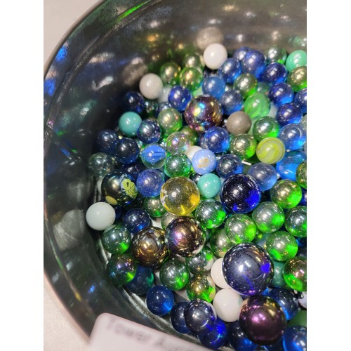 46 - A tub of modern marbles mostly are iridescent solid colours all in good condition.