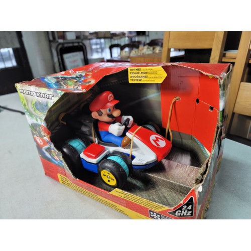 47 - Boxed remote control Mario Kart racing car along with a boxed RC turbo buggy Buzz Lightyear Toy stor... 