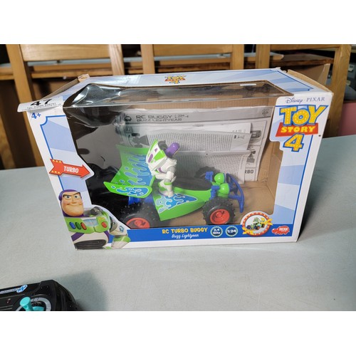 47 - Boxed remote control Mario Kart racing car along with a boxed RC turbo buggy Buzz Lightyear Toy stor... 