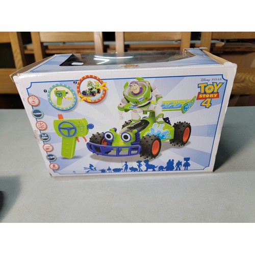 47 - Boxed remote control Mario Kart racing car along with a boxed RC turbo buggy Buzz Lightyear Toy stor... 