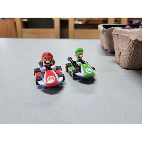 51 - Mario Kart Carrera slot car racing set, has track cars remotes etc