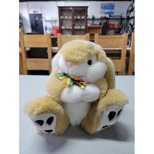 53 - Large bunny formed plush toy in good order with dickiebow, stands at 34cm high