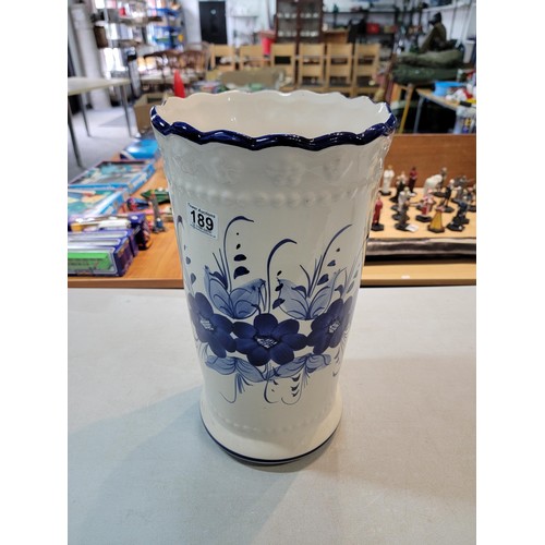 189 - Large ceramic tall umbrella stand in good order with a blue floral design 44cm high 24cm diameter al... 