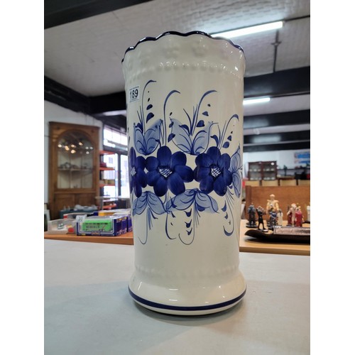 189 - Large ceramic tall umbrella stand in good order with a blue floral design 44cm high 24cm diameter al... 