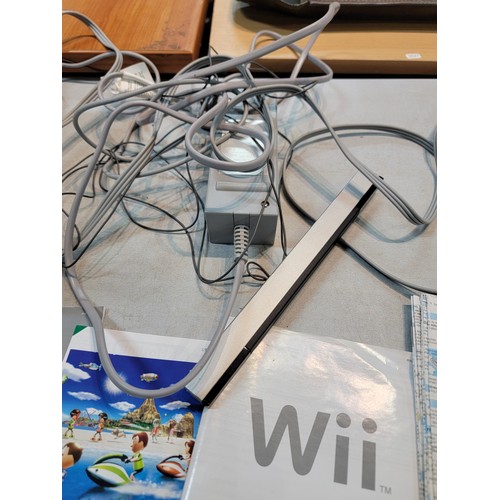 193 - Nintendo Wii with motion plus Wii remote, steering wheel, Wii fit board and Wii Fit Resort game disk... 